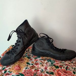 Black leather Converse All Star high tops